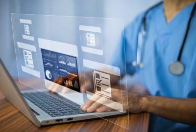 Doctor using computer Document Management System (DMS), online documentation database process automation to efficiently manage files